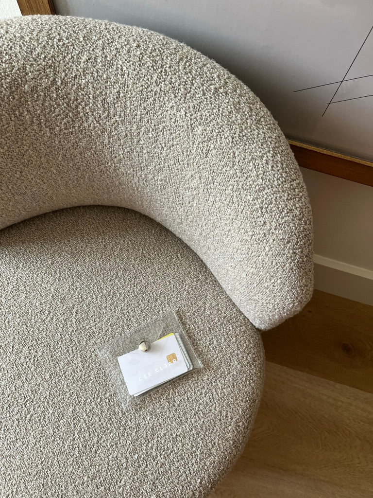 Image: CEE CLEAR mini purse perched on a seat in a hotel in Barcelona Spain
