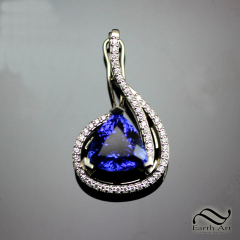 Tanzanite trillion pendant in white gold with diamonds and a pearl enhancer bail