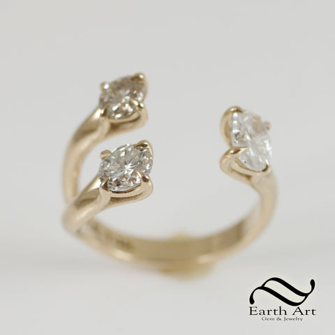 Custom yellow gold triple claw Diamond ring in an open ring concept using the customers diamonds.