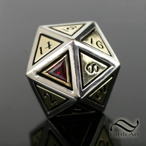 A full sized solid yellow and white gold D20 with a lab created ruby