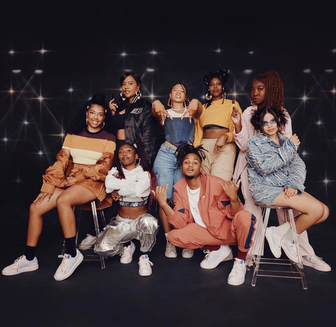 Storm Reid x New Balance, posing in a group with 7 other models