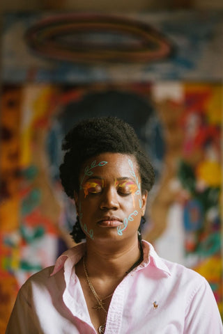 Shaneika Marson and painting featuring makeup by Lindsay Kastuk