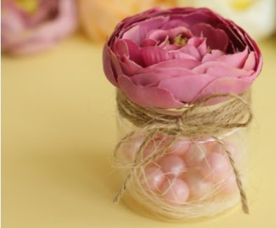 pink rose in a candy jar with jute twine