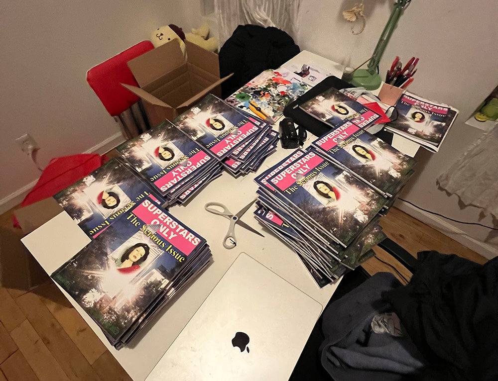 Copies of Superstars Only laid across a table
