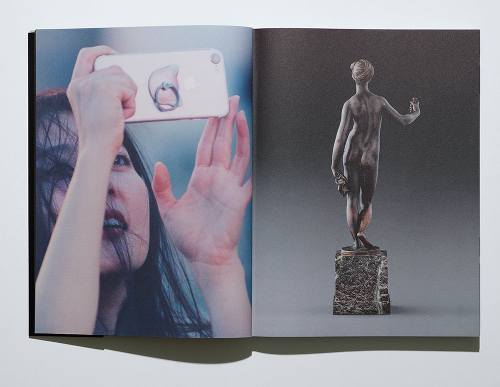 A spread from Epoch: on left an image of a woman holding up an iPhone; on right, an ancient sculpture with hand hel aloft as if taking a selfie.