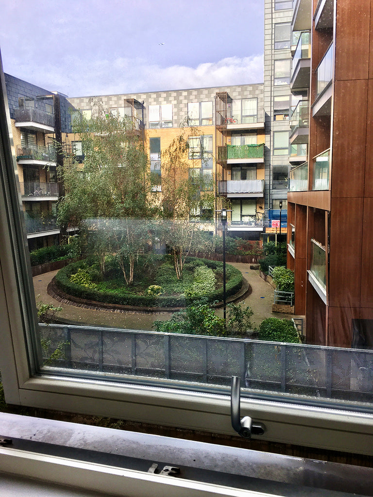 View of modern apartment with opne square and trees