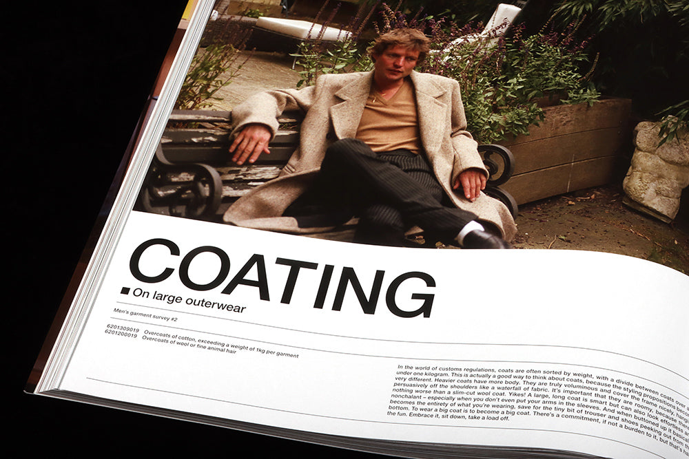 Close up of page shows man modelling a beige coat, with large headline, ‘Coating’