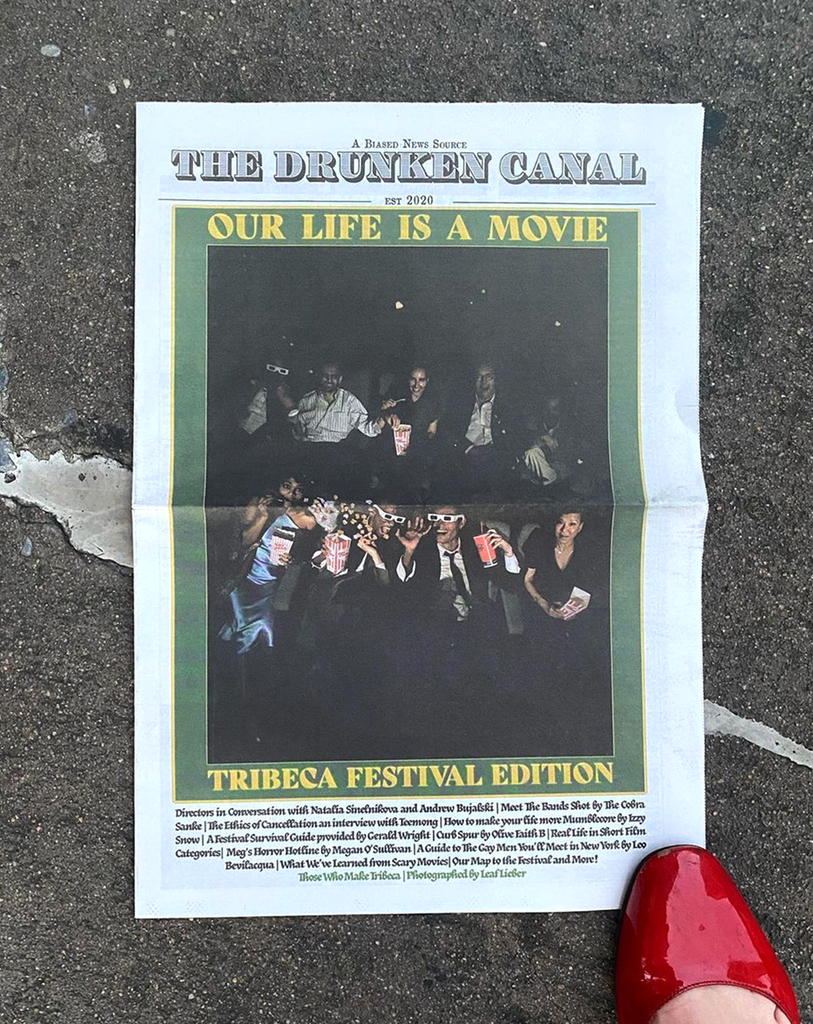 Front cover of The Drunken Canal newspaper, on floor with a red shoe
