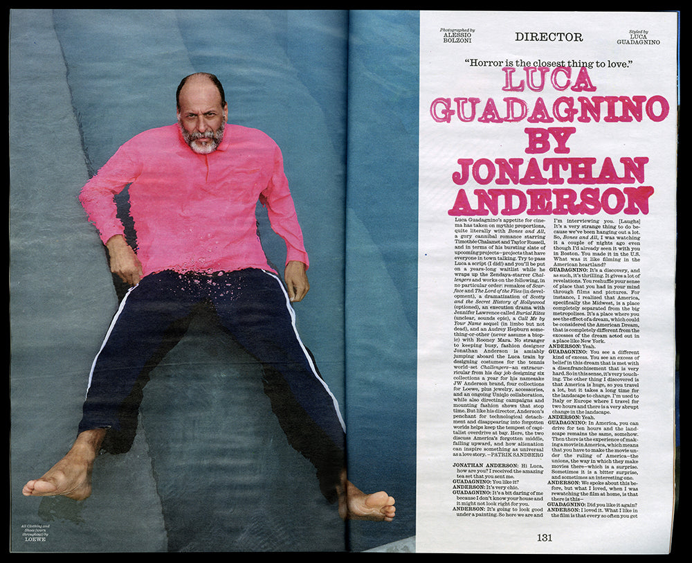 Double page from Interview magazine, showing a portriat of a man in a bright pink top against a blue backgound, opposite a white page with vivid pink headline