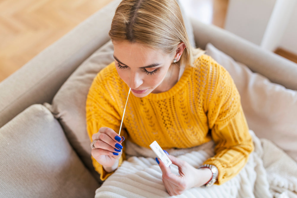 woman taking a covid test