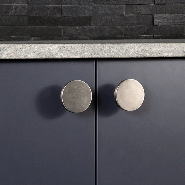 Momo Handles Como Knob 41mm Brushed Nickel on navy blue kitchen cabinets | Bathroom Warehouse