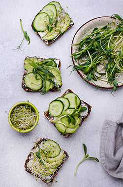 toasts with avocado and microgreens