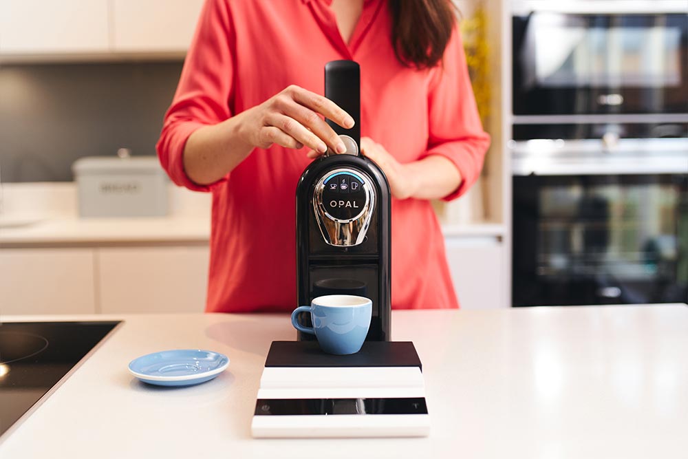 Artisan-coffee-co-pod-machine-callibration-care-guide-pod-brew-chamber-espresso-hold-button
