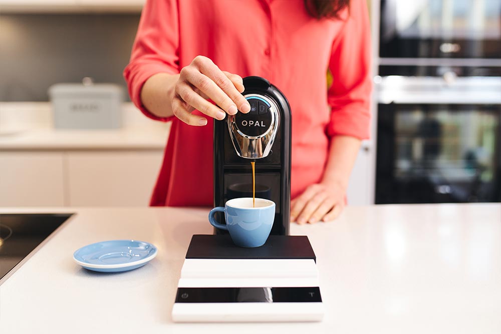 Artisan-coffee-co-pod-machine-callibration-care-guide-hold-button-blue-cup-espresso-pour