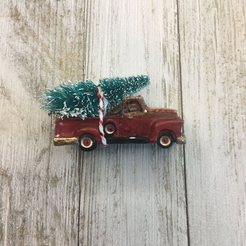 Tree tied to red truck