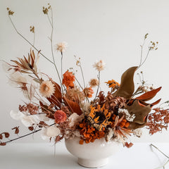 Dried flower arrangement in Autumnal tones.