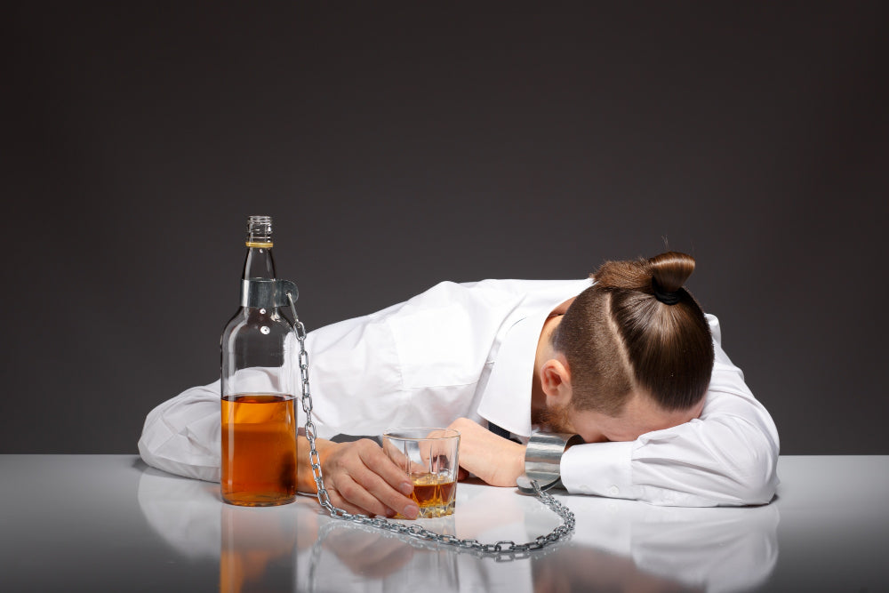 Tired young man drinking
