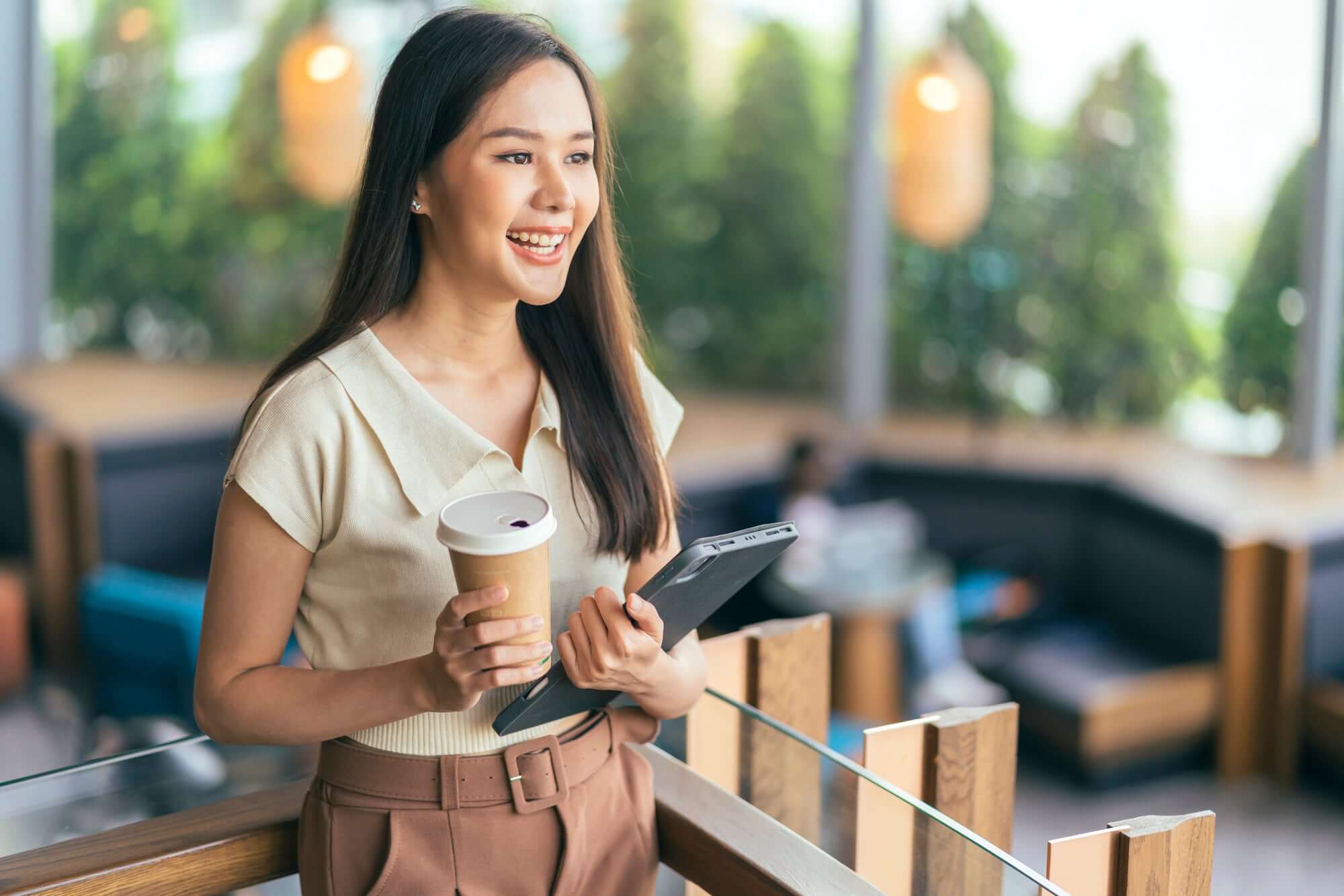 Girl Holding a Coffee