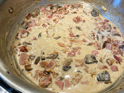 Sauce is thickening and cleaning sides of pan