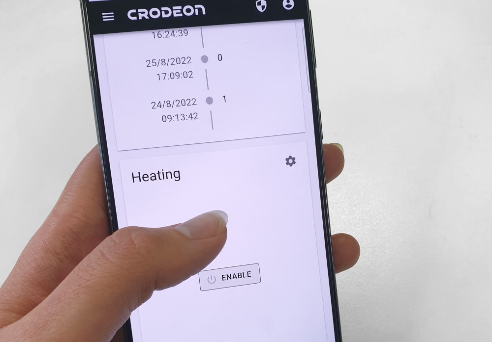 A picture of a phone with on the display an image of the Crodeon Dashboard