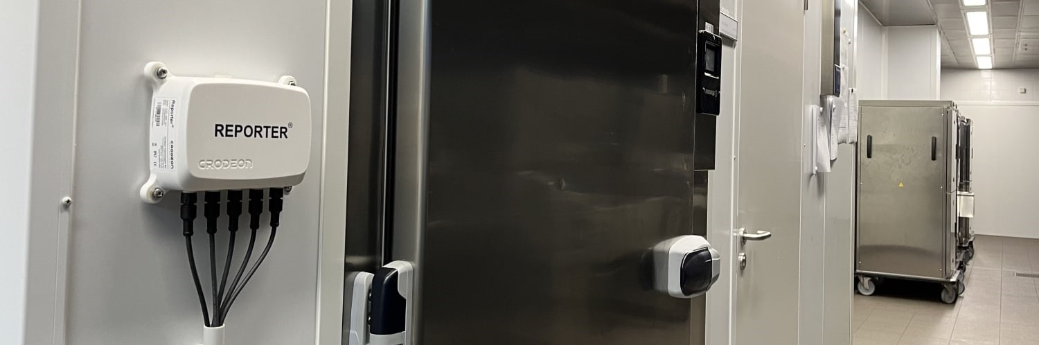 Reporter mounted next to a cold room for remote temperature monitoring