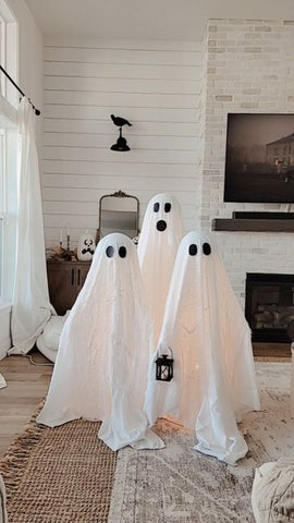 DIY Ghosts on Front Porch. White with black eyes. 