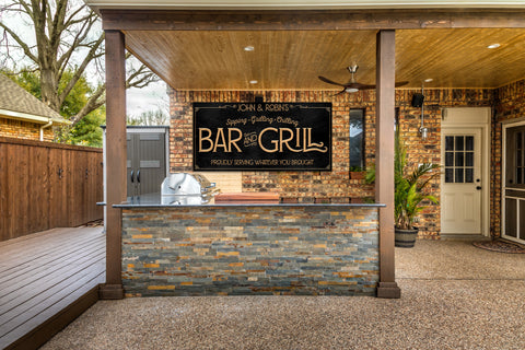 Custom bar and grill signs with personalized family name. Modern gold font on sleek black metal background. 