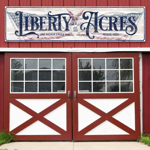 Large Outdoor Metal Patriotic Sign. Reads Liberty Acres with American Flag as Backdrop and Large Cursive Font