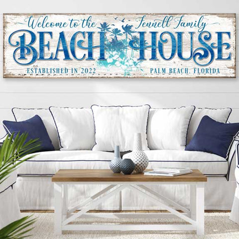 Beach house wall art with custom family name. White canvas with coastal inspired artwork.