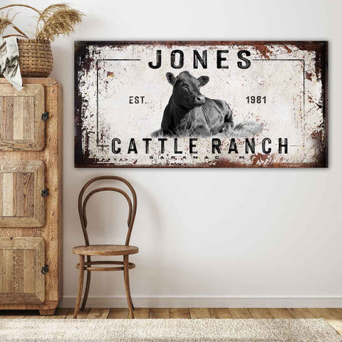 Cattle Ranch Sign on rustic canvas background with a cow laying in the grass and the words {family name} Cattle Ranch