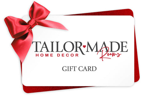 Image of Tailor Made Rooms gift card with red bow in upper left hand corner of white gift card.