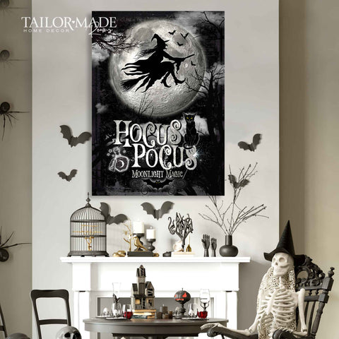 Hocus Pocus Halloween Wall Art hanging above black and gold Halloween mantle. Black witch flying across full moon.