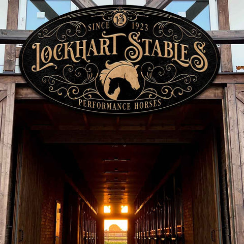 Custom large metal oval ornate stable sign for performance horses. Black background with elegant gold lettering. 