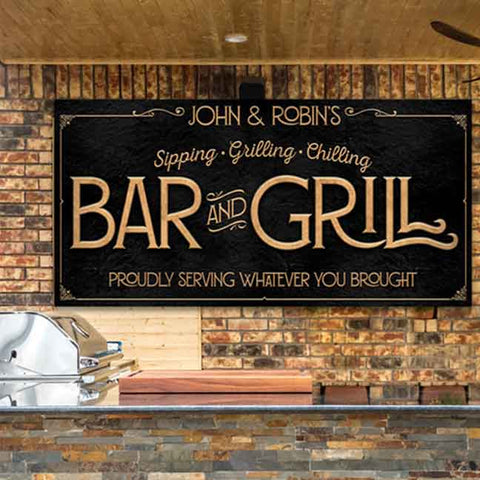 Custom Backyard Bar and Grill Metal Sign. Black metal canvas with gold lettering Reads "Proudly Serving Whatever You Brought" With Subheading "Sipping, Grilling, and Chilling." 