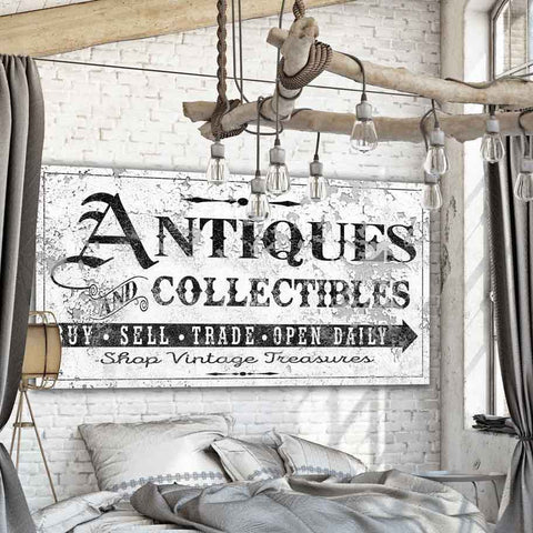 Antique farmhouse sign. Reads "Antiques & Collectables" on a white vintage style canvas.