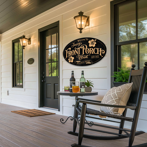 front porch sign with rocking chair in front of window