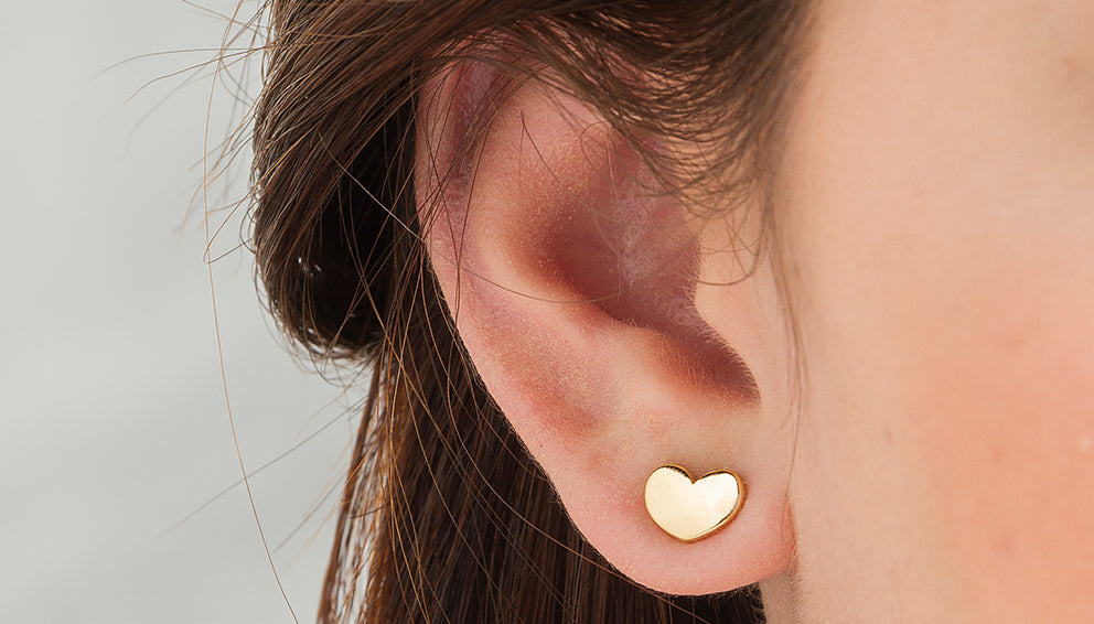 Gold Heart Earlobe Piercing