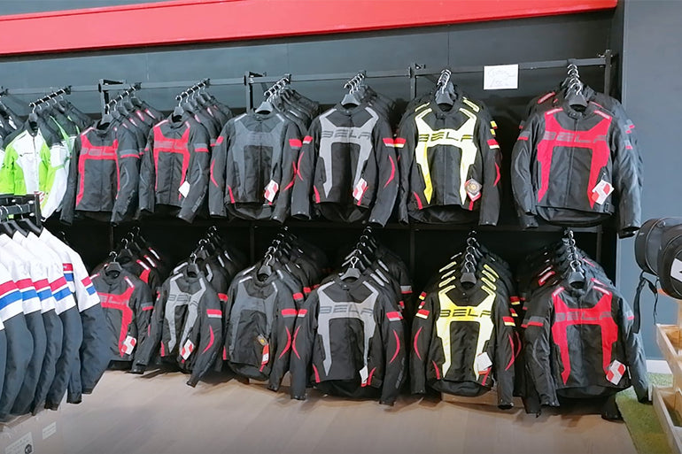 a collection of motorcycle jackets at maximo moto astle park store.