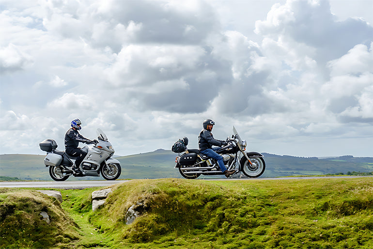 two motorbike riders are riding in a beautiful uk weather