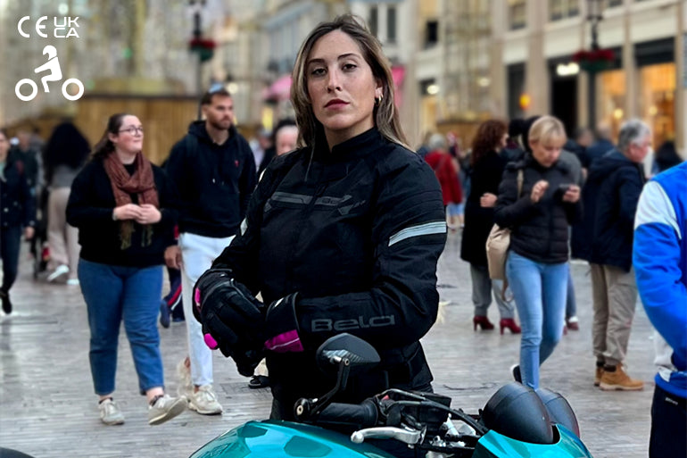 a female motorbike rider is wearing maximo moto textile jacket