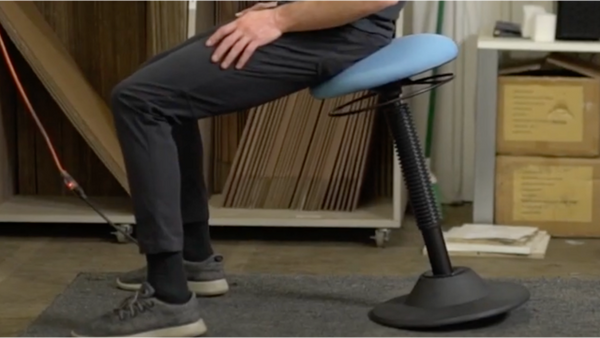 Person sitting on an office rocker chair