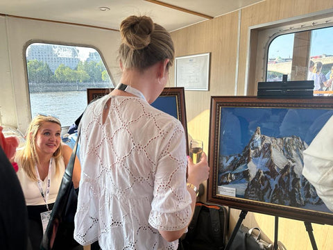 Person looking at my art on the Listex Luxury event- Soft Pastels Mountain Art by Martina Diez-Routh