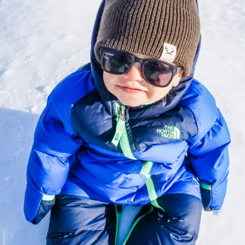 Baby wearing Roshambo sunglasses during Winter