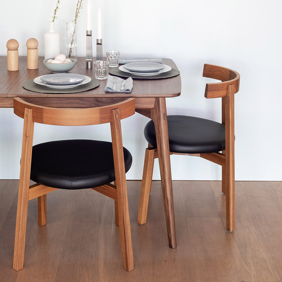 Wooden table and chairs with tableware accessories