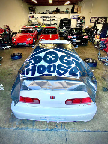 Doghouse Garage Large 6x6 Custom Banner on rear of Acura Integra inside shop