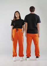 APOPHIS jogging pants details: cotton orange pants with logo embroidered on the leg and side slip pockets. Joggers available in S,M,L, XL. 100% cotton pants. Unisex. MADE IN ITALY. Shop the latest APOPHIS Collection on our official online store.  Acquista i pantaloni APOPHIS sul sito ufficiale.
