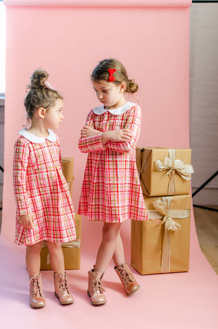 Girls in pink Christmas dresses