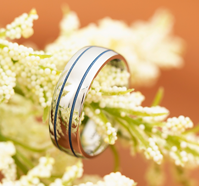 cobalt chrome mens wedding rings with polar blue cerakote makes a colorful handmade wedding ring