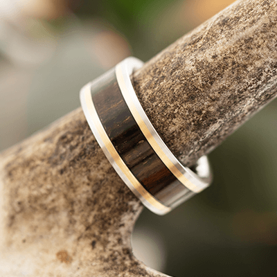 Outdoor mens laser designed wedding rings with wood sleeves 