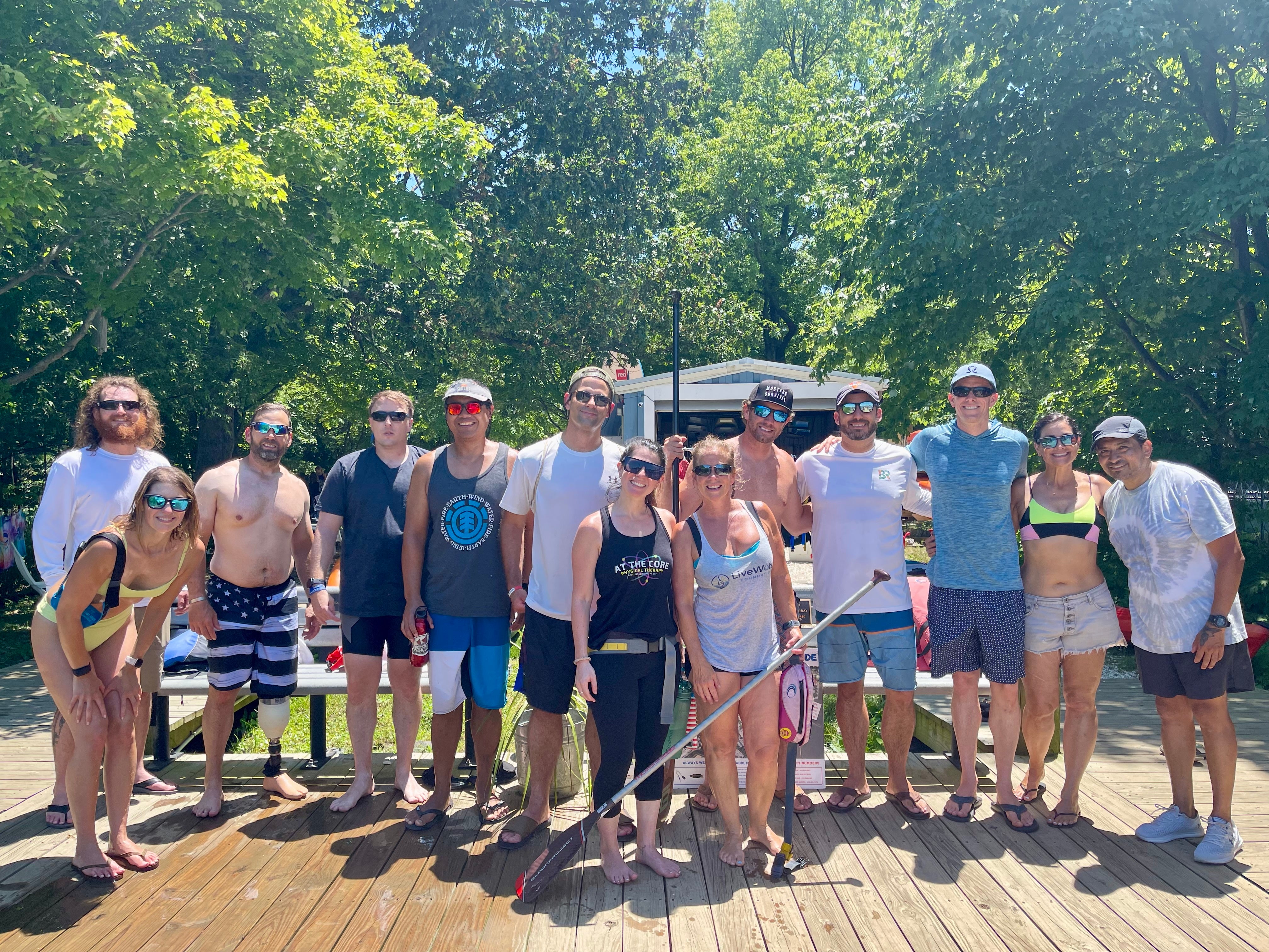 Wai Koa paddlers and Live Water Foundation volunteers posing for a photo after a paddle